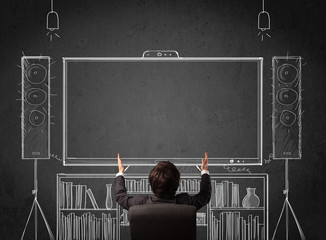 Businessman in front of a home cinema system