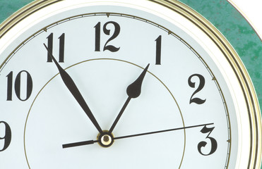 Almost one hour on big wall clock part isolated close up