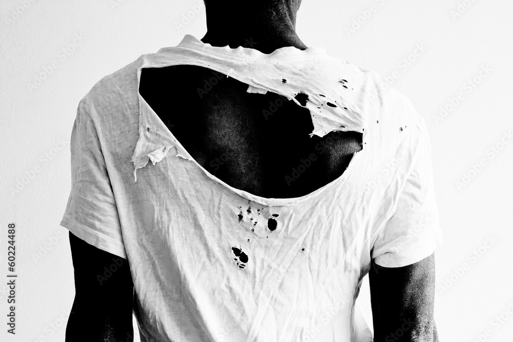 Wall mural man's back with ripped t-shirt