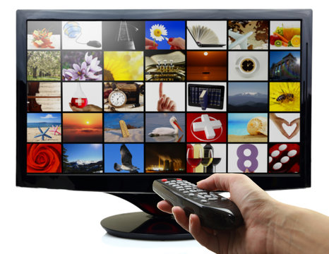 Smart tv with photos and hand holding remote control