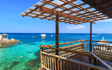 Bamboo hut over crystal clear sea