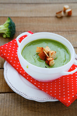 green vegetable cream soup with croutons