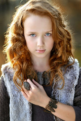 portrait of a beautiful little redhead girl