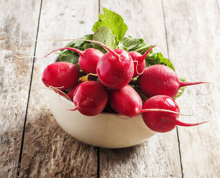 radishes in wooden background