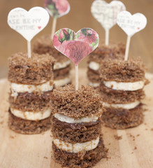Canape biscuit with banana and walnut - chocolate cream.