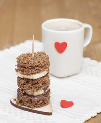 Canape biscuit with banana and walnut - chocolate cream. Cup of