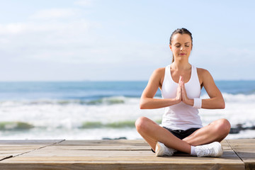 calm young woman meditating