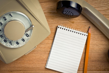 old telephone with notebook