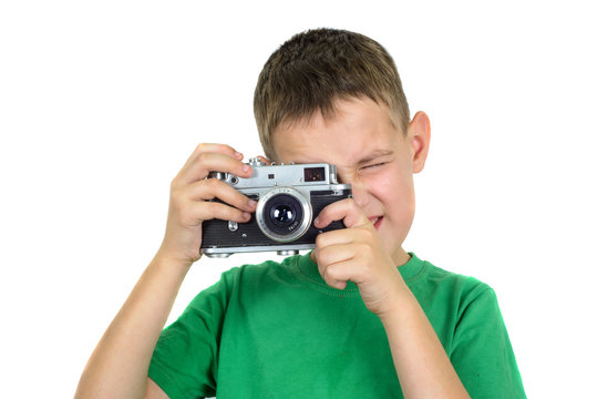Boy taking photos by vintage camera