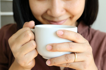 coffee cup in woman hand.