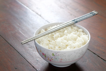 rice in white bowl with chopstick