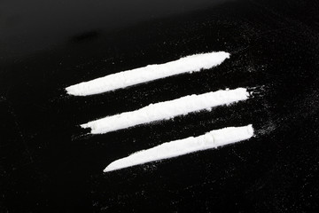 cocaine powder in three lines