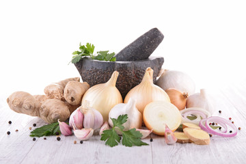 mortar with garlic,onion and herbs
