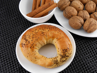 sweet cake, walnut and cinnamon on white plate