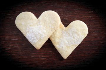 Fototapeta premium Heart of the cookies and the wooden background.