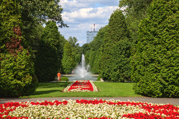 Fountain in city park with flowers in Bialystok, Poland