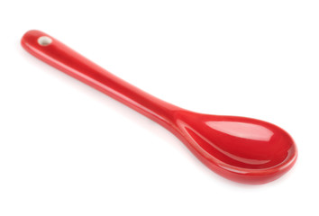 Single red porcelain spoon