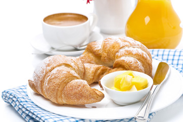 croissants with butter, espresso and orange juice for breakfast