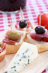 sliced prosciutto with olive sheese and Cherry tomato