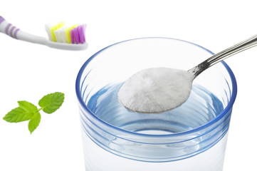 Iron spoon of baking soda close up