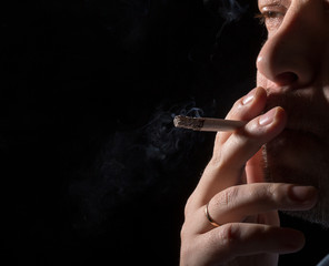 Fototapeta premium Portrait man smoking cigarette
