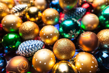 pile of colorful Christmas balls with blurred background