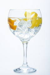 orange lemon and lime gin tonic isolated over white