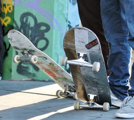skateboard skate board teenage friends in skate park with skateboards background copy space stock, photo, photograph, image, picture, 