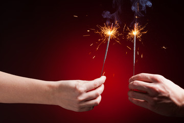 sparklers in hands