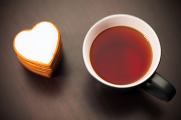 cookie heart and cup of tea