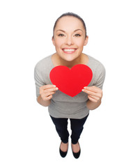 smiling asian woman with red heart