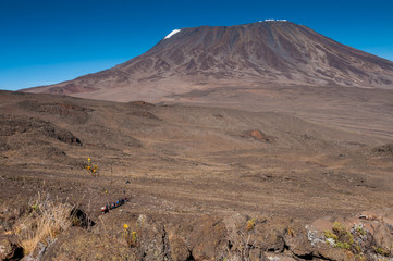 Trekkers crossing the saddle on Kilimanjaro