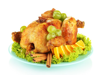 whole roasted chicken with lettuce, grapes, oranges and spices