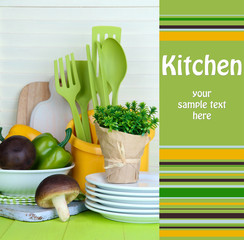 Plastic kitchen utensils in cup on wooden table