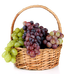 Fresh grape in wicker basket, isolated on white