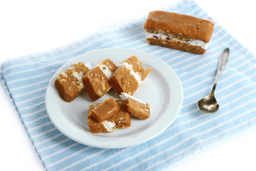 Sherbet with nuts on plate isolated on white