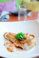 Fried chicken breast with vegetables and froth sauce