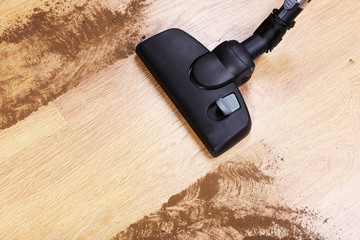 Vacuuming floor in house