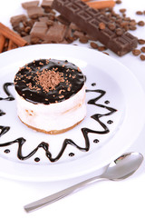 Sweet cake with chocolate on plate close-up
