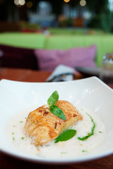 Fried fish fillet with broth sauce