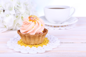 Tasty cake on table on light background