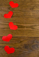 Paper hearts on wooden  background