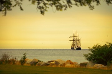 Beautiful sailing ship on sea at dusk