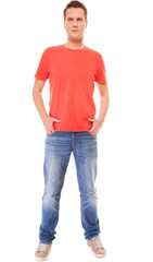 Obraz premium Young man guy red t-shirt jaens with hands in pockets isolated