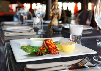 Salmon steak on restaurant table