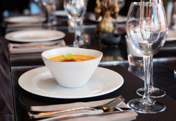 Pumpkin soup on restaurant table