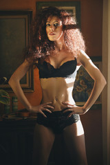 Fototapeta na wymiar Fashion model posing in black lingerie
