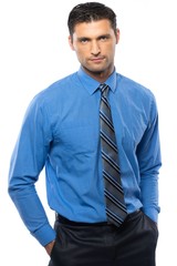 Handsome young man in blue shirt and tie