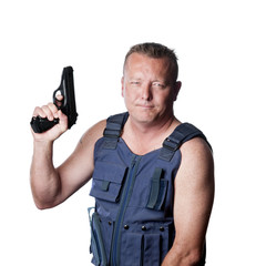 caucasian male with gun and kevlar vest