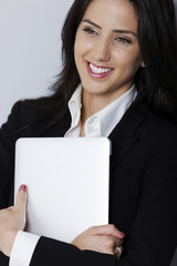 Woman holding her laptop